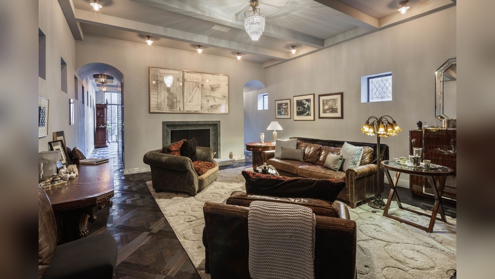 A Living Room With Furniture And a Chandelier Taylor