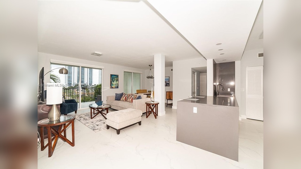 A Living Room With Furniture And Kitchen View North Miami